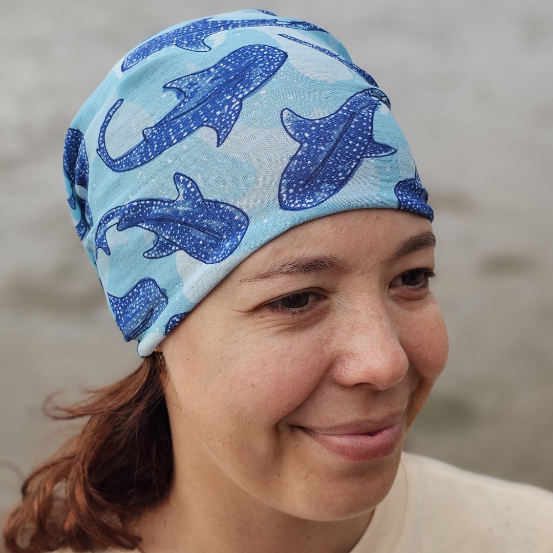 Blue Whale Shark Multi-Use Sun Buff featuring a repeating whale shark print